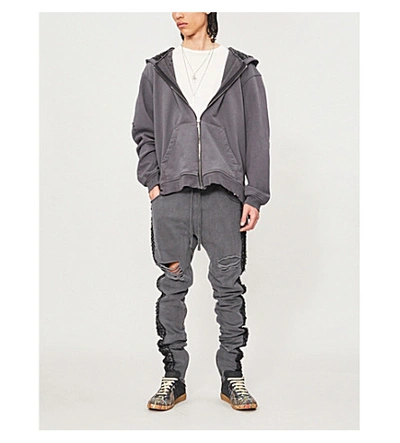 Shop Alchemist Ripped Woven-panel Cotton-jersey Jogging Bottoms In Black