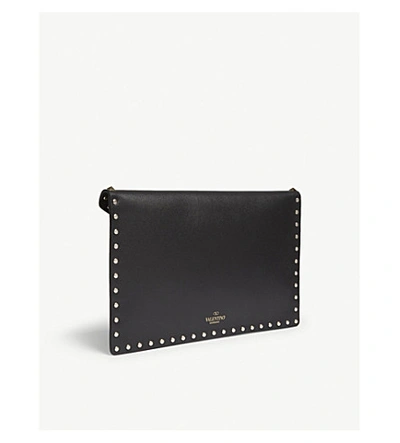 Shop Valentino Rockstud Grained Leather Envelope Clutch In Black