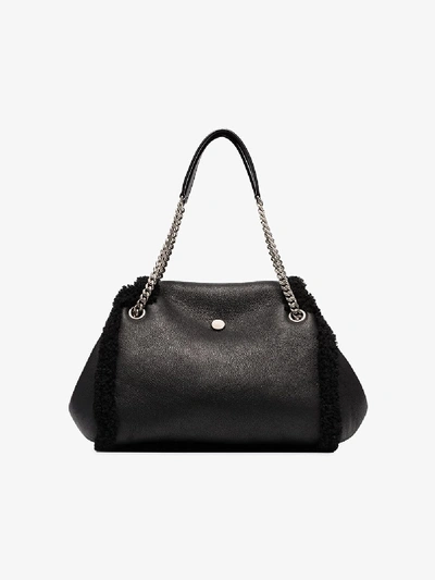 Shop Saint Laurent Black Nolita Small Shearling Shoulder Bag