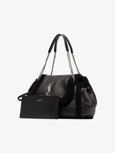 Shop Saint Laurent Black Nolita Small Shearling Shoulder Bag