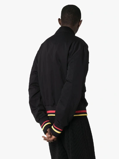 Shop Jw Anderson Multi Pocket Padded Bomber Jacket In Black