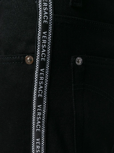 Shop Versace Denim Jeans In Black