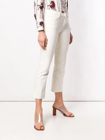 Shop J Brand Mid Rise Cropped Bootcut Selena Jeans In White