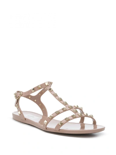 Shop Valentino Rockstud Flat Sandals In Pink