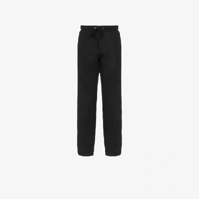 Shop Valentino Vltn Print Trousers In Black