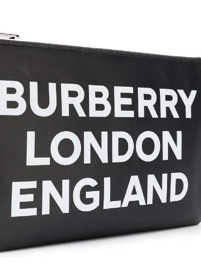 Shop Burberry Printed Leather Clutch In Black