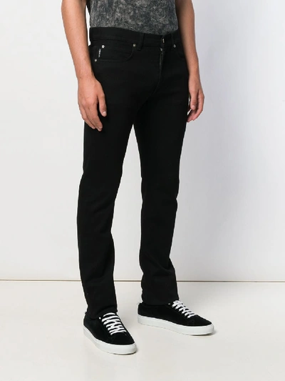 Shop Versace Classic Jeans In Black