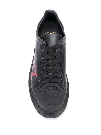 Shop Versace Logo Sneakers In Black