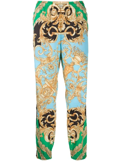 Shop Versace Printed Trousers In Green