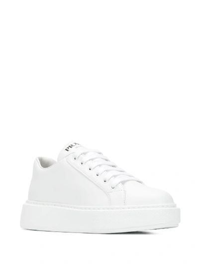 Shop Prada Leather Sneakers In White