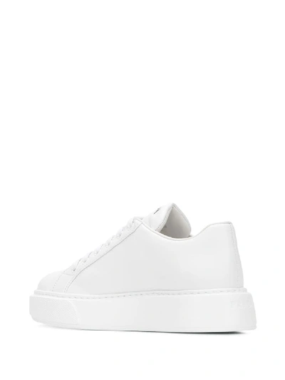 Shop Prada Leather Sneakers In White