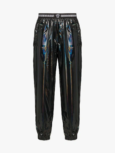 Shop Versace Holographic Track Trousers In 101 - Black