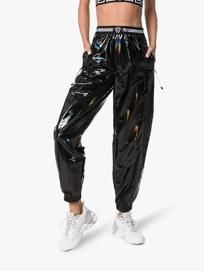 Shop Versace Holographic Track Trousers In 101 - Black