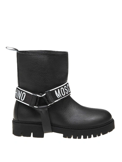 Shop Moschino Leather Booties With Logoed Straps In Black