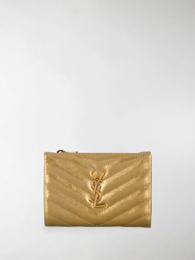 Shop Saint Laurent Monogram Compact Wallet In Gold
