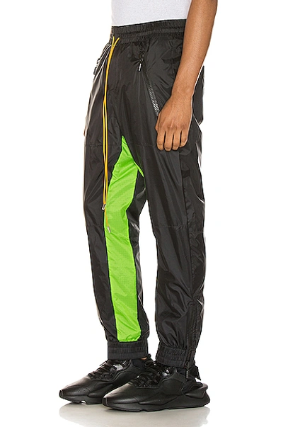 Shop Rhude Flight Suit Pant In Black,green In Black & Neon Green