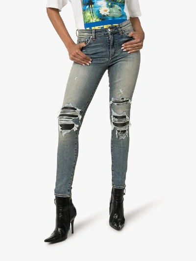 Shop Amiri Mid-rise Ripped Skinny Jeans In Blue