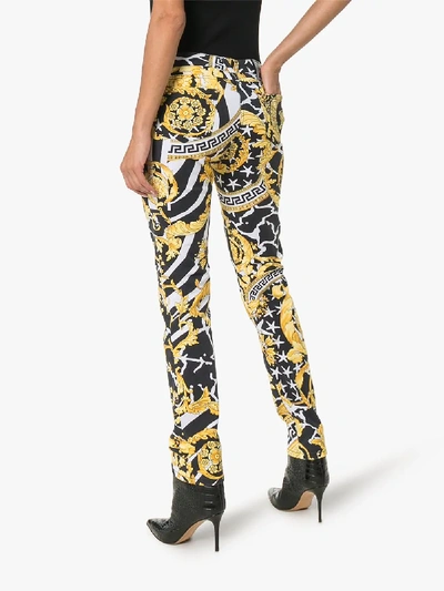 Shop Versace Baroque Print Straight Leg Jeans In A7900