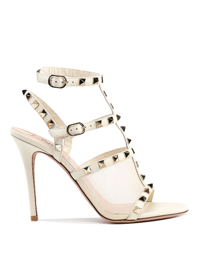 Shop Valentino Rockstud Leather Sandals In White