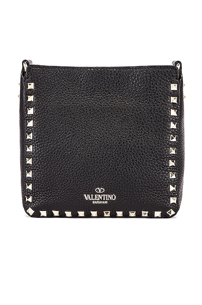 Shop Valentino Rockstud Messenger Bag In Black