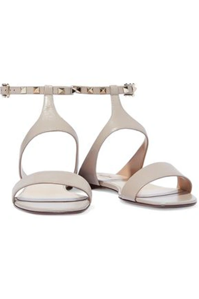 Shop Valentino Rockstud Leather Sandals In Neutral