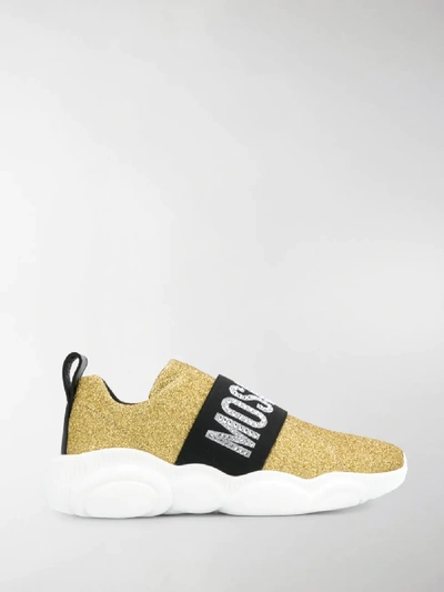 Shop Moschino Logo Glitter Sneakers In Gold