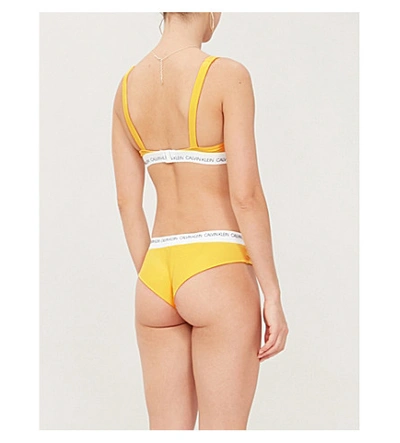 Calvin Klein Logo-print Triangle Bikini Top In 707 Habanero Gold | ModeSens