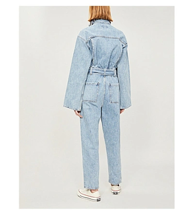 Shop Agolde Tatum Faded Waist-tie Denim Jumpsuit In Lark