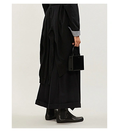 Shop Aganovich Pleated Wide-leg Wool Trousers In Black