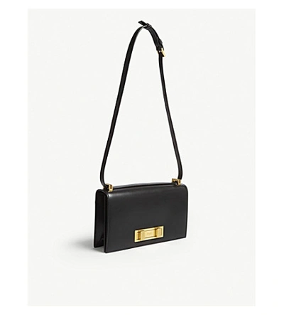 Shop Saint Laurent Black And Gold Domino Leather Shoulder Bag In Black/gold