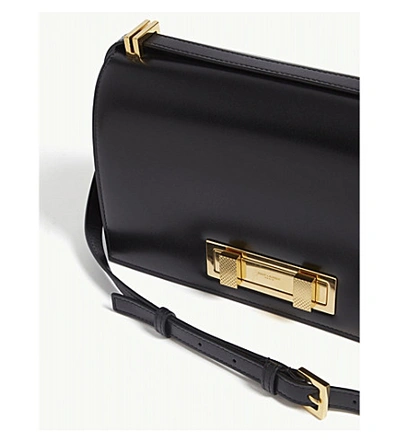 Shop Saint Laurent Black And Gold Domino Medium Leather Shoulder Bag In Black/gold