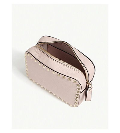 Shop Valentino Rockstud Leather Cross-body Bag In Water Rose