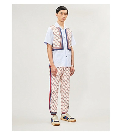 Shop Gucci Logo-print Woven Jogging Bottoms In Ivory Navy L.red