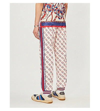 Shop Gucci Logo-print Woven Jogging Bottoms In Ivory Navy L.red