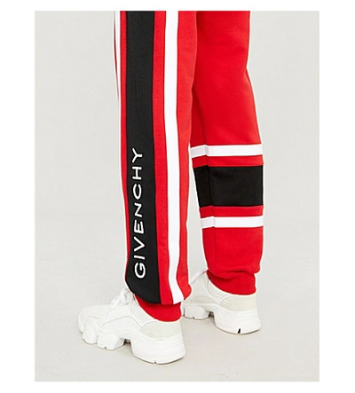 Shop Givenchy Logo-embroidered Cotton-jersey Jogging Bottoms In Red/black