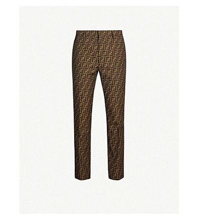 Shop Fendi Logo-print Slim-fit Straight Woven Trousers In Brown