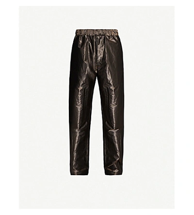 Shop Fendi Metallic Tapered Shell Trousers In Gold
