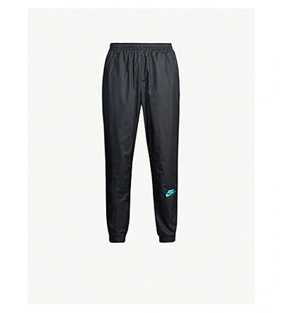 Shop Nike X Atmos Shell Trousers In Black/hyper Pink