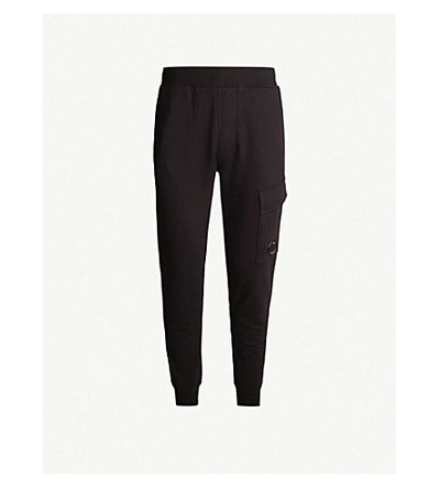Shop C.p. Company Cargo Pocket Relaxed-fit Cotton-jersey Jogging Bottoms In Black