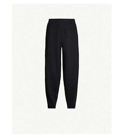 Shop Givenchy Logo-tape Cotton-jersey Jogging Bottoms In Black
