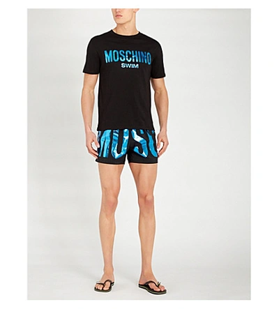 Shop Moschino Metallic Logo-print Relaxed-fit Swim Shorts In Blue