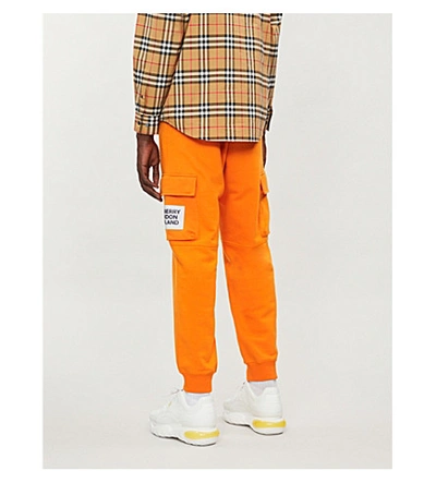 Shop Burberry Patch-pocket Cotton-jersey Jogging Bottoms In Bright Orange