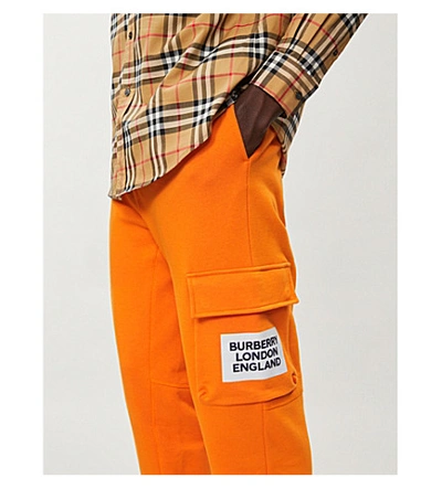 Shop Burberry Patch-pocket Cotton-jersey Jogging Bottoms In Bright Orange