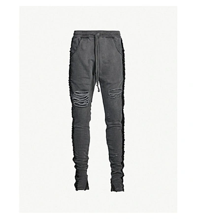 Shop Alchemist Ripped Woven-panel Cotton-jersey Jogging Bottoms In Black