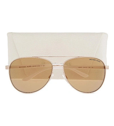Shop Michael Kors Mk5007 Hvar Aviator Sunglasses In Gold