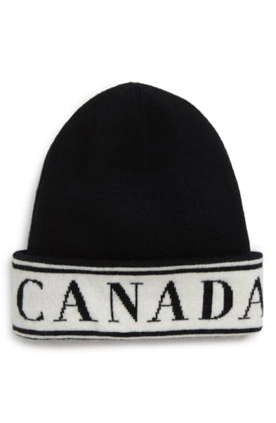 Shop Canada Goose Logo Merino Wool Beanie In Black