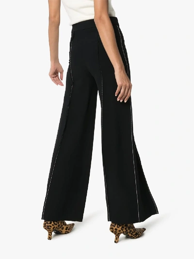 Shop Marni Contrast Stitch Flared Trousers In Black
