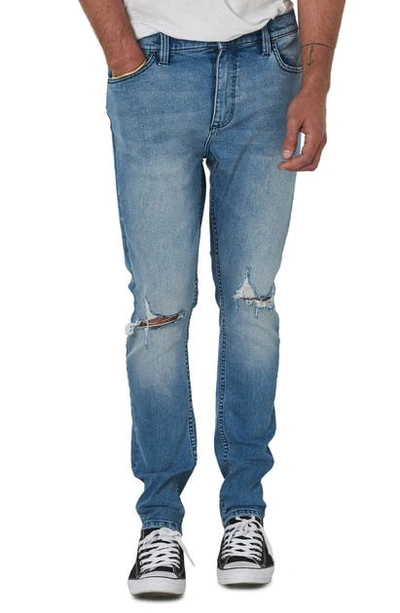 Shop Rolla's Tim Slims Fast Times Worn Destroyed Slim Fit Jeans In Light Blue