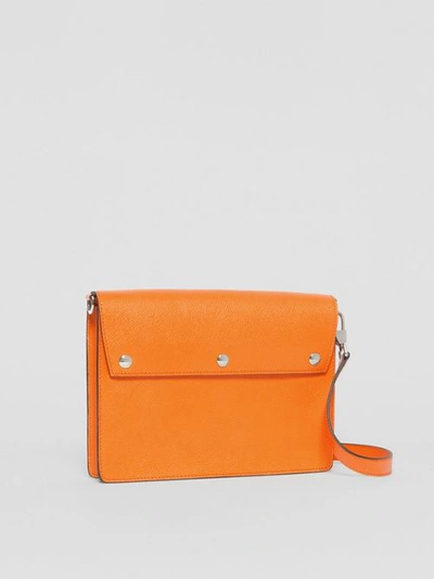 Shop Burberry Triple Stud Grainy Leather Crossbody Bag In Bright Orange