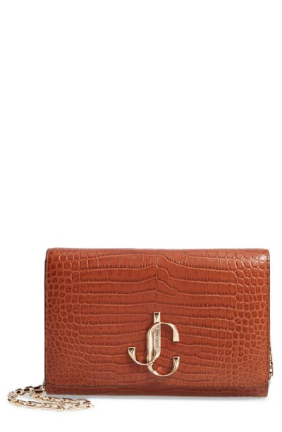 Shop Jimmy Choo Varenne Croc Embossed Leather Clutch In Cuoio